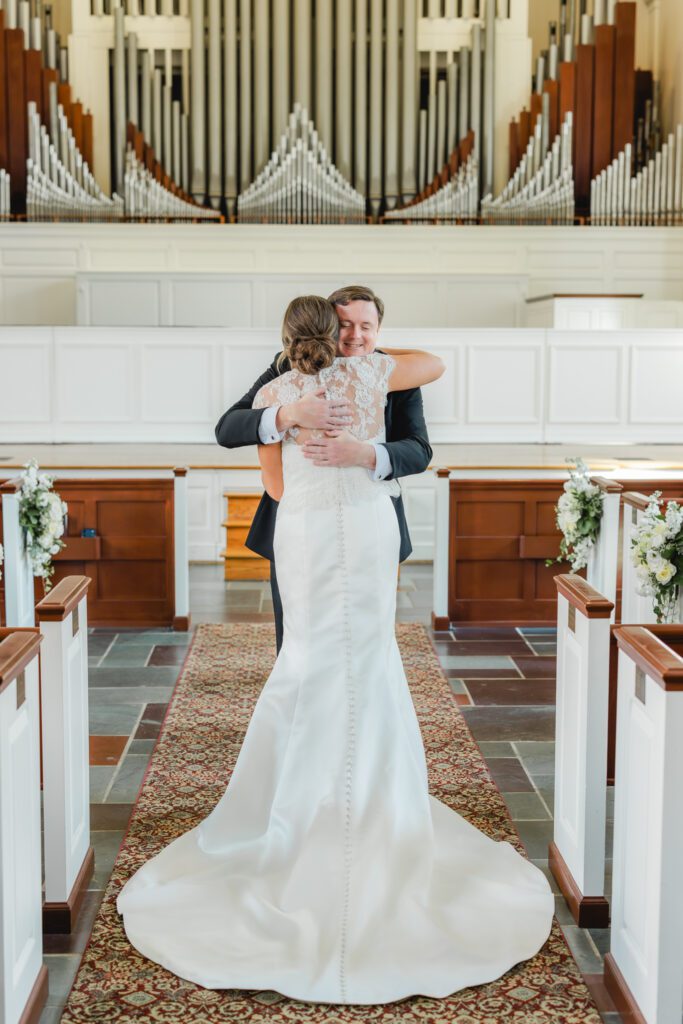 First look moment before Reid Chapel wedding in Birmingham Alabama with bride and brother