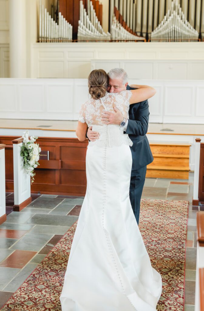 First look moment before Reid Chapel wedding in Birmingham Alabama with bride and father