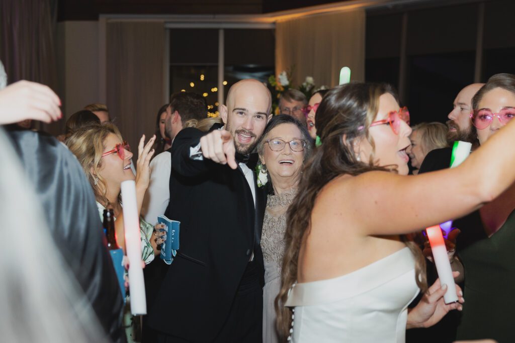 Guests dancing at a Birmingham Alabama wedding reception with lively celebration