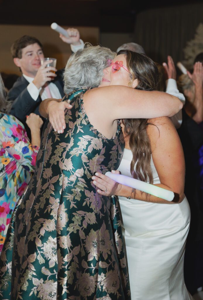 Guests dancing at a Birmingham Alabama wedding reception with lively celebration
