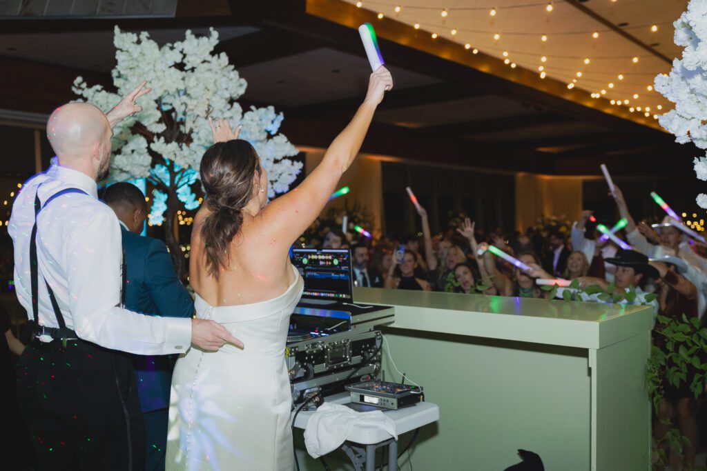 Guests dancing at a Birmingham Alabama wedding reception with lively celebration