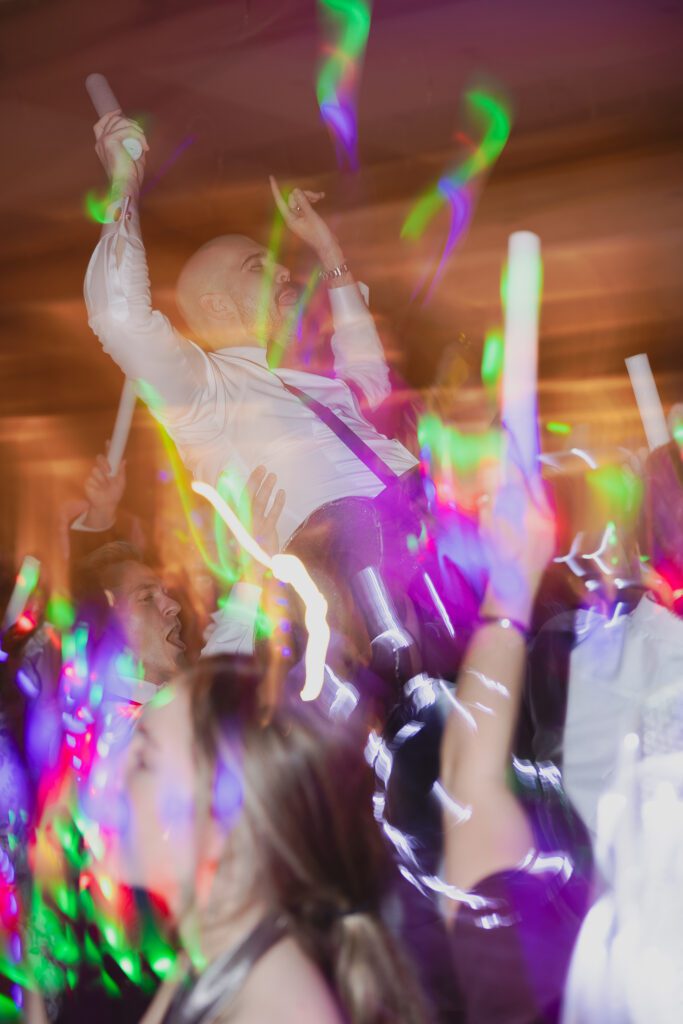 Guests dancing at a Birmingham Alabama wedding reception with lively celebration