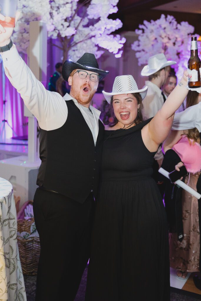 Guests dancing at a Birmingham Alabama wedding reception with lively celebration
