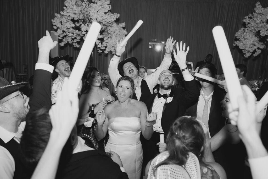 Guests dancing at a Birmingham Alabama wedding reception with lively celebration