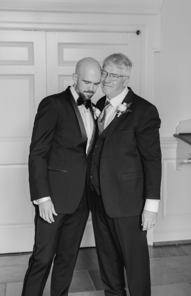 Groom getting ready with father in a classic suit from Mr Burch’s for a Birmingham Alabama wedding