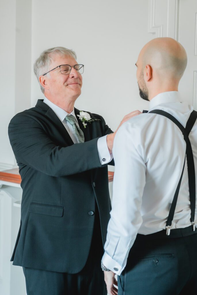 Groom getting ready with father in a classic suit from Mr Burch’s for a Birmingham Alabama wedding
