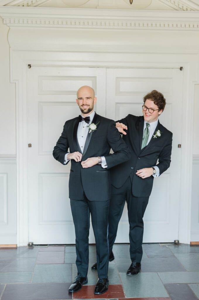 Groom getting ready with best man in a classic suit from Mr Burch’s for a Birmingham Alabama wedding