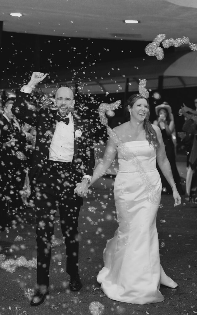 Bride and groom leave out at The Club Birmingham wedding reception