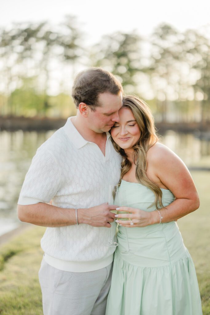 newly engaged couple at sunset on Smith Lake Alabama after proposal