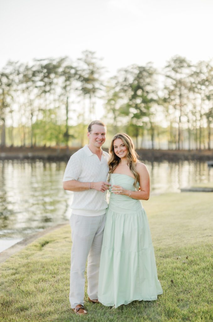 newly engaged couple at sunset on Smith Lake Alabama after proposal
