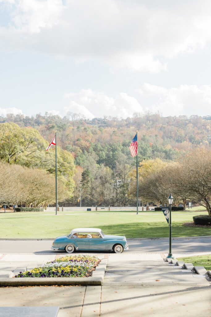 Reid Chapel venue picture with a classic car with a garden party wedding aesthetic in Birmingham Alabama