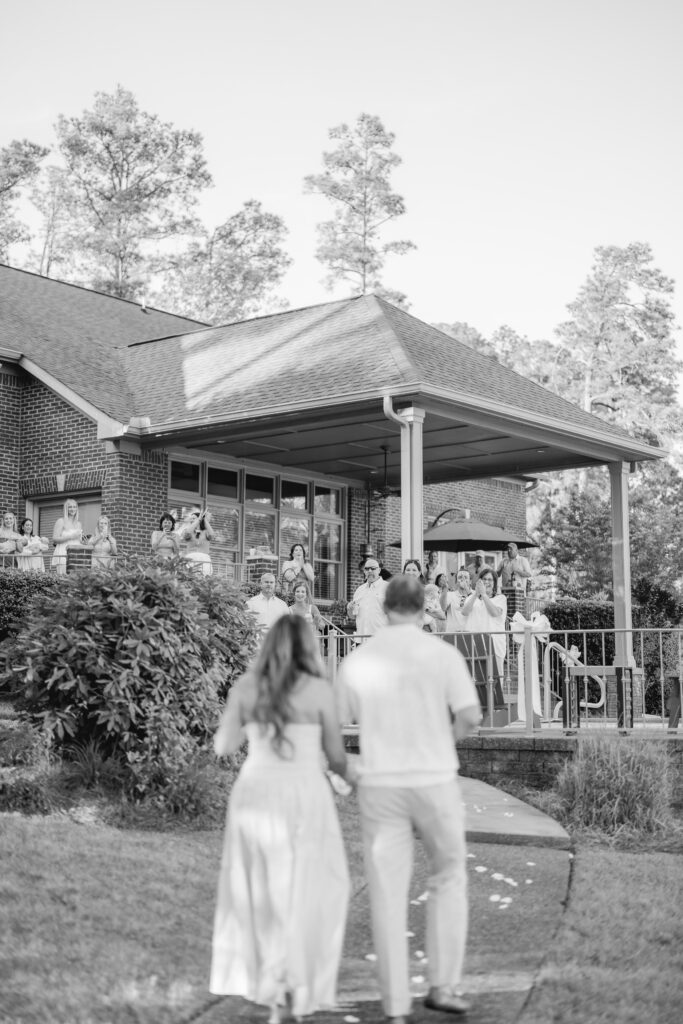 friends and family celebrating engagement at Smith Lake Alabama lake house