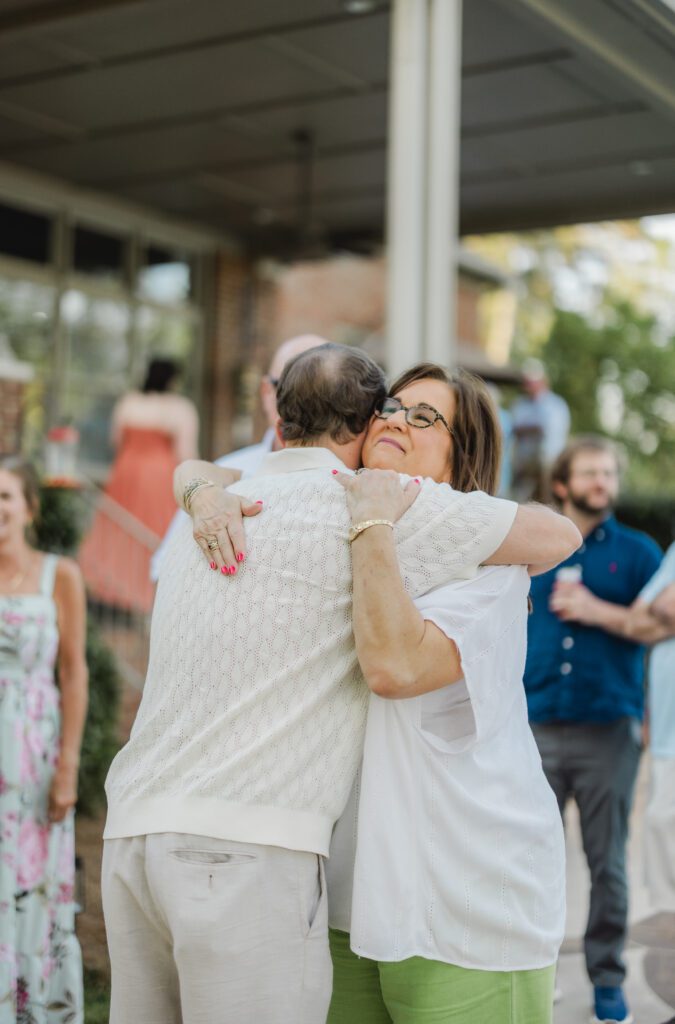 friends and family celebrating engagement at Smith Lake Alabama lake house
