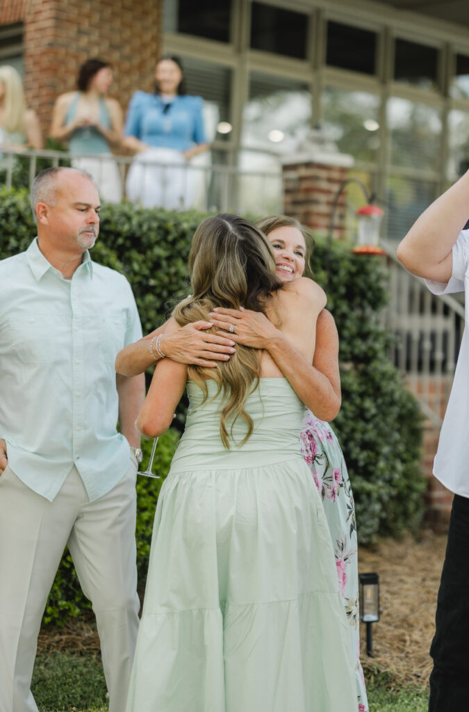 friends and family celebrating engagement at Smith Lake Alabama lake house