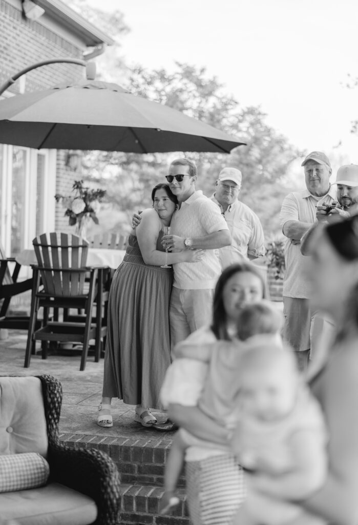 friends and family celebrating engagement at Smith Lake Alabama lake house