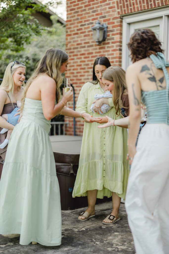 friends and family celebrating engagement at Smith Lake Alabama lake house