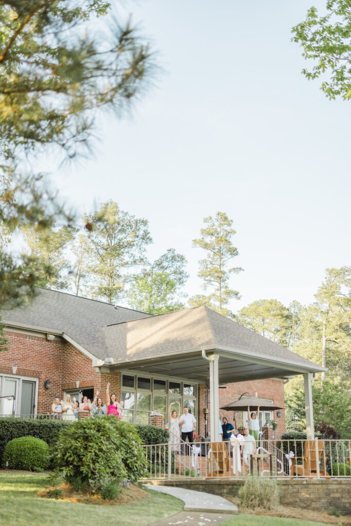 friends and family celebrating engagement at Smith Lake Alabama lake house