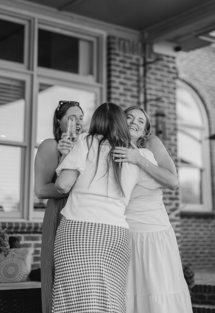 friends and family celebrating engagement at Smith Lake Alabama lake house
