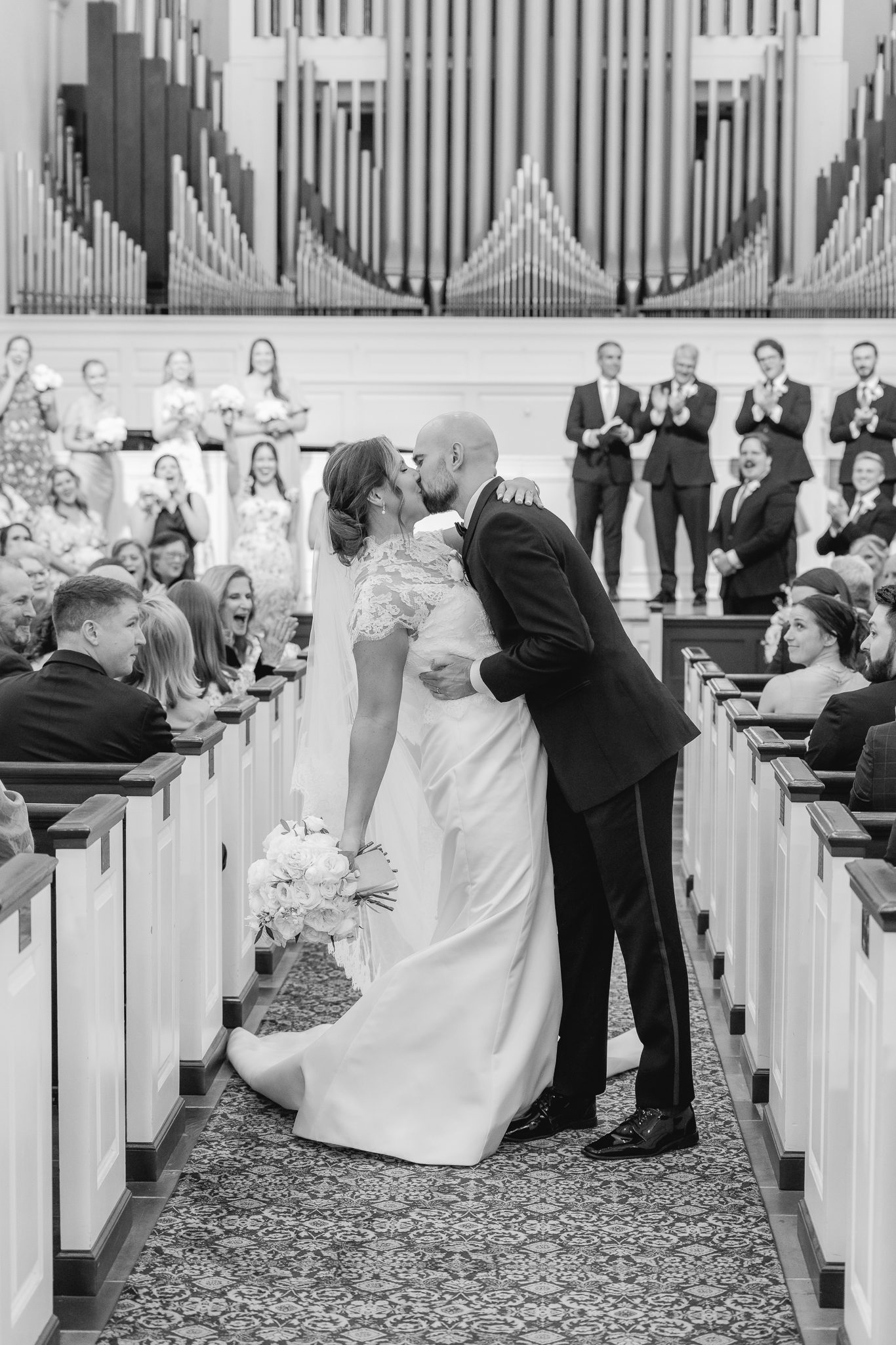 Wedding ceremony at Reid Chapel in Birmingham Alabama with bride and groom celebrating down the aisle