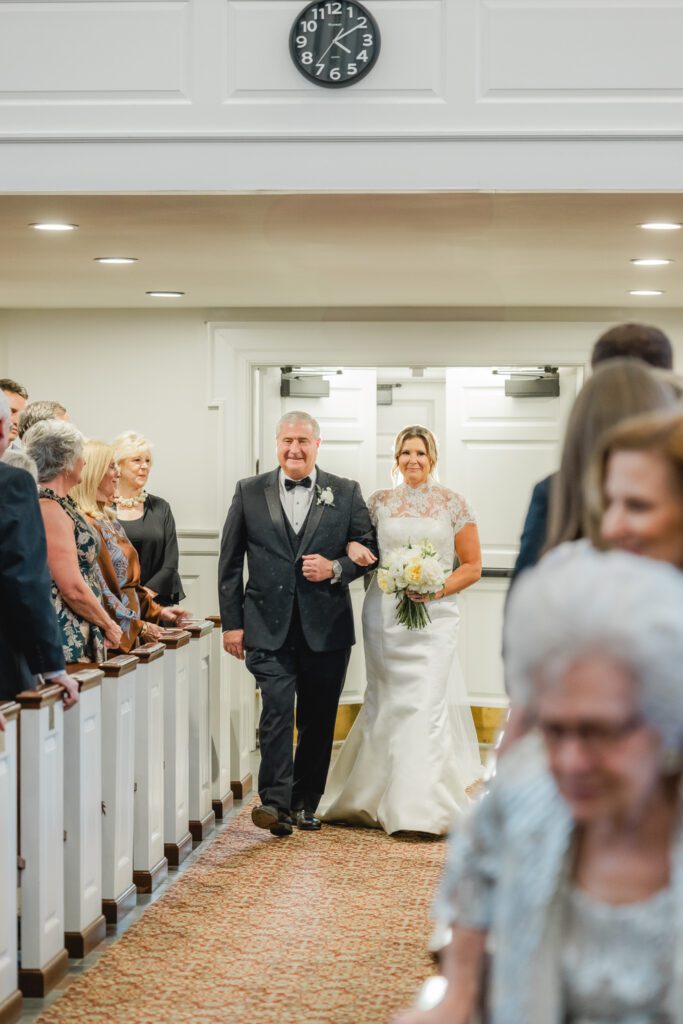 Wedding ceremony at Reid Chapel in Birmingham Alabama with bride walking down the aisle