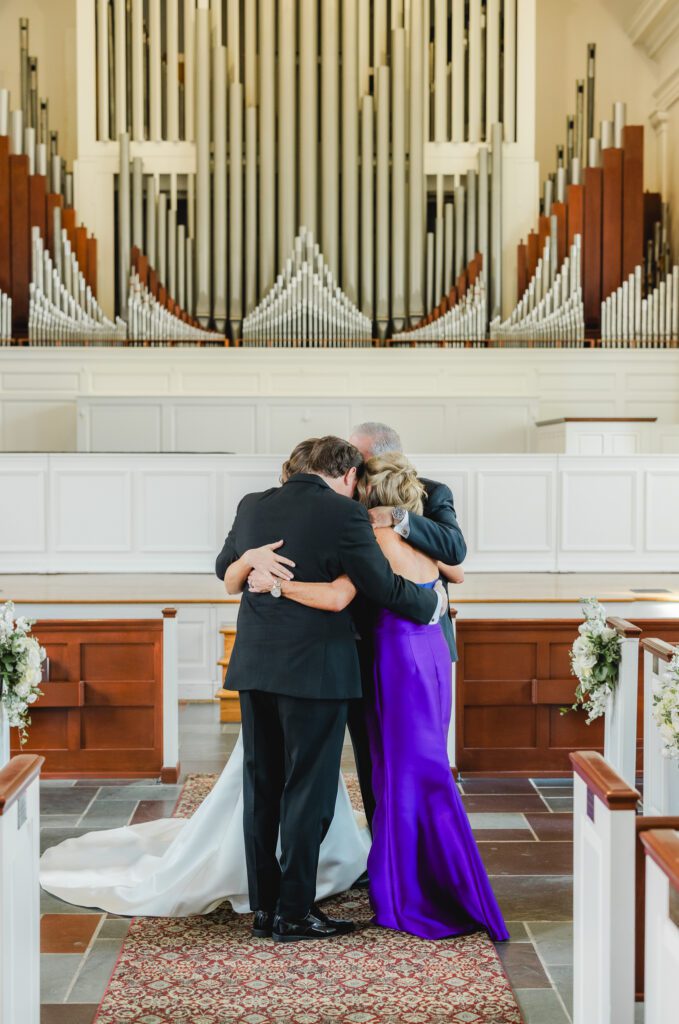 First look moment before Reid Chapel wedding in Birmingham Alabama with family