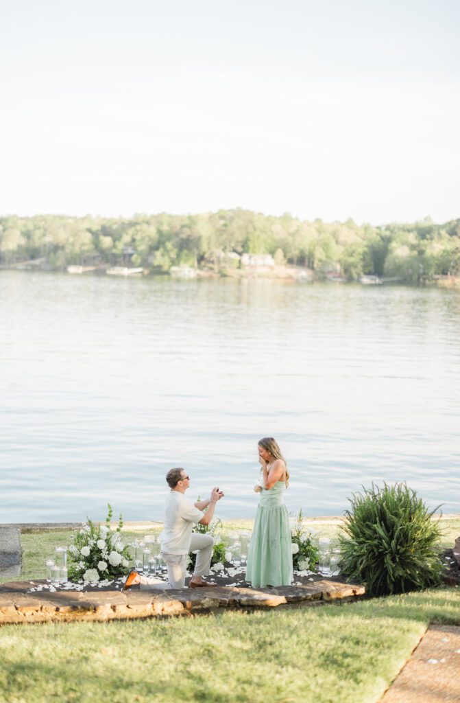 man proposing on one knee during lakeside proposal at Smith Lake Alabama