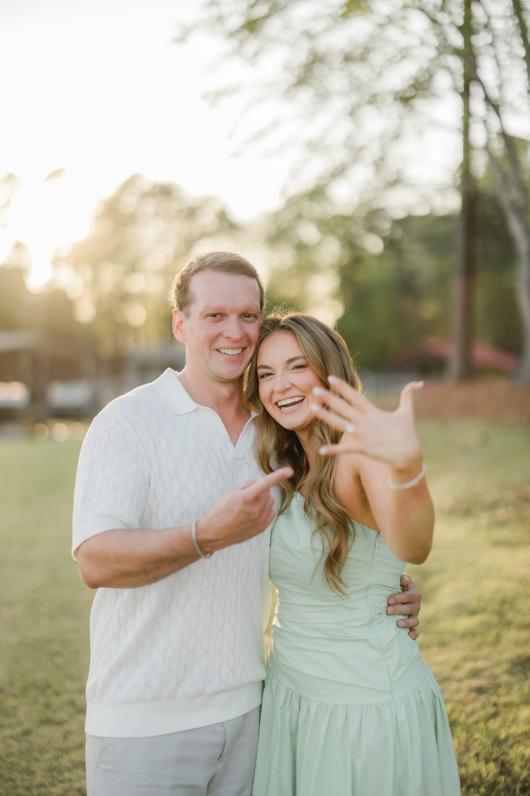 newly engaged couple at sunset on Smith Lake Alabama after proposal