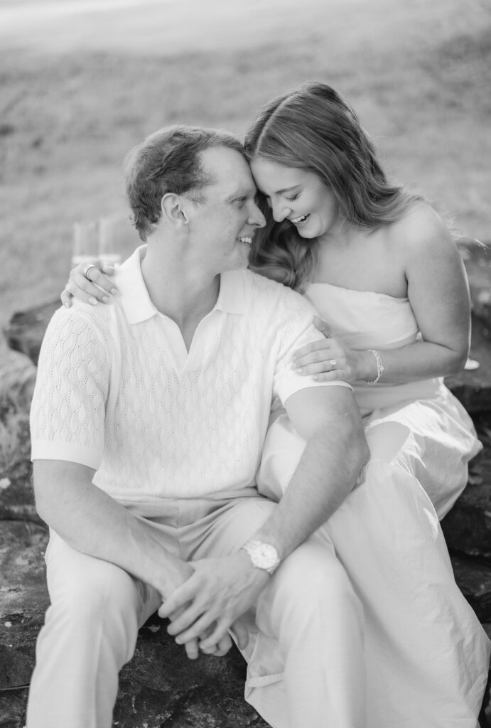 newly engaged couple at sunset on Smith Lake Alabama after proposal