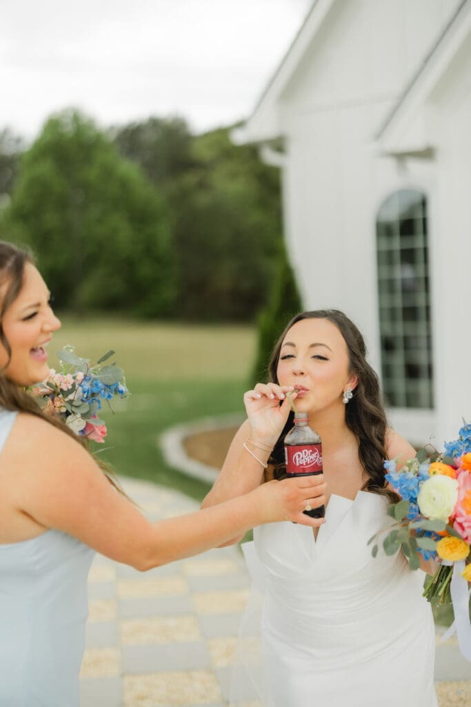 Bridal party with colorful florals and dr pepper at Hoyt Hollow wedding in Alabama
