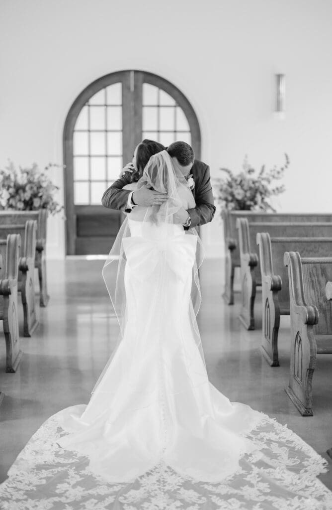 Bride sharing emotional first look with her father on wedding day