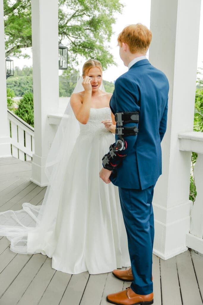 Bride sharing emotional first look with little brother before wedding