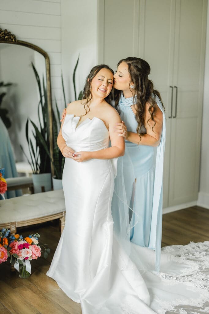 Bride getting ready with sister before Hoyt Hollow wedding ceremony