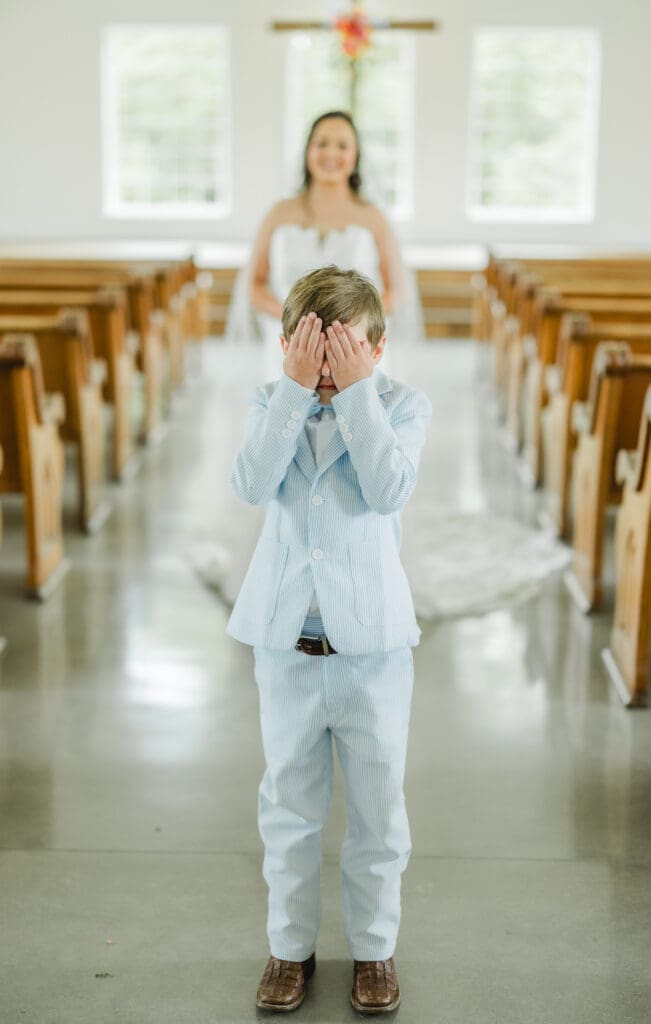 Sweet first look moment between bride and young family member