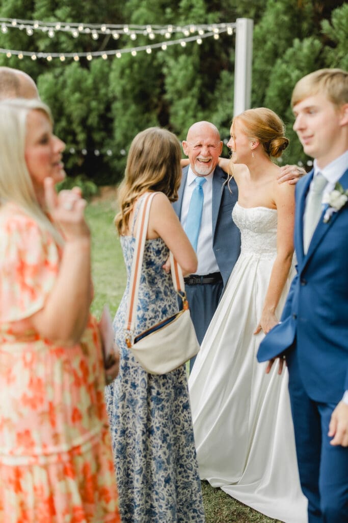 Couple celebrating with unique lemonade bar during Birmingham wedding cocktail hour