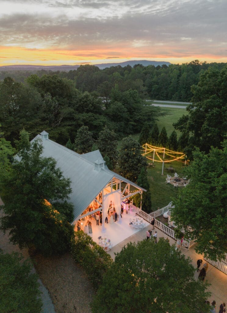 Drone photo of wedding reception with colorful sunset in Birmingham