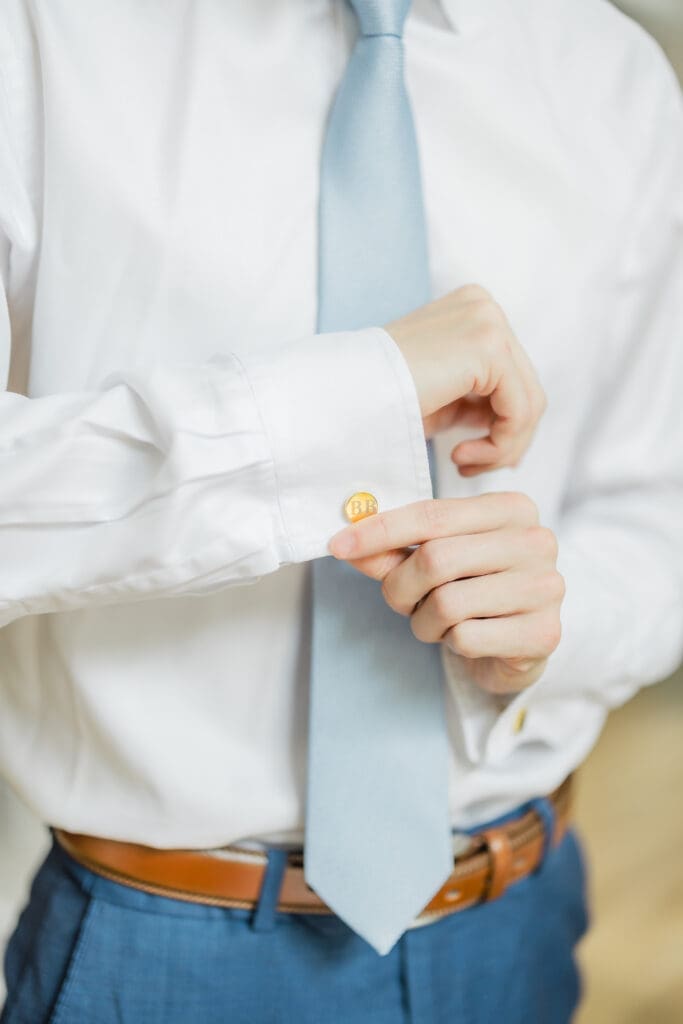 Groom getting ready before Hoyt Hollow wedding ceremony