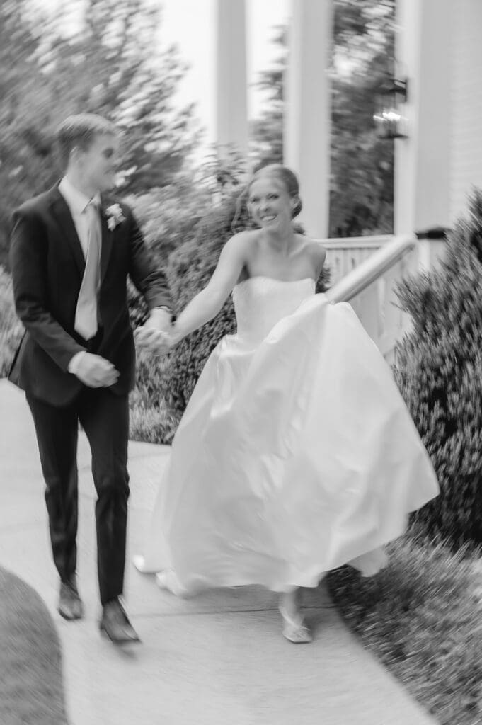 Joyful bride and groom laughing together on wedding day