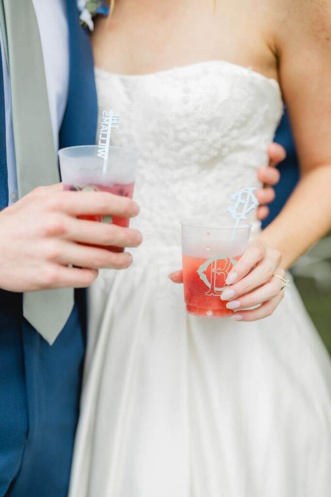 Couple celebrating with unique lemonade bar during Birmingham wedding cocktail hour