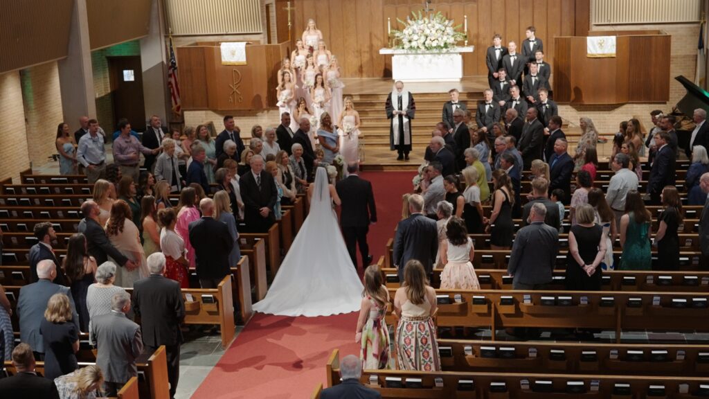 Bride walking down the aisle during Birmingham church wedding