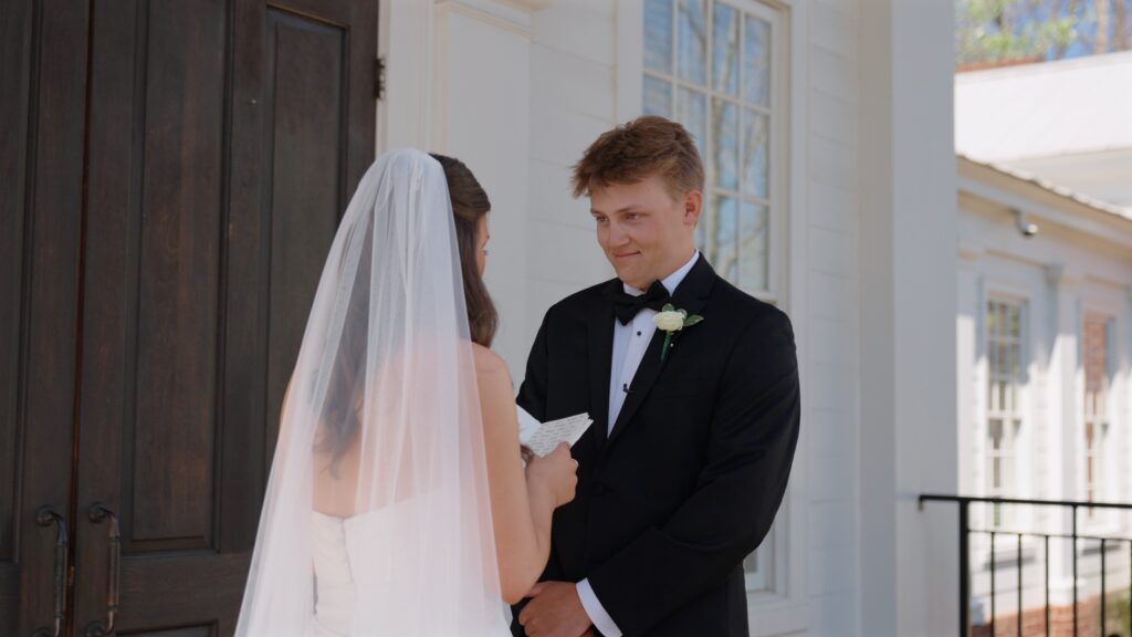 Groom smiling during emotional Birmingham vows