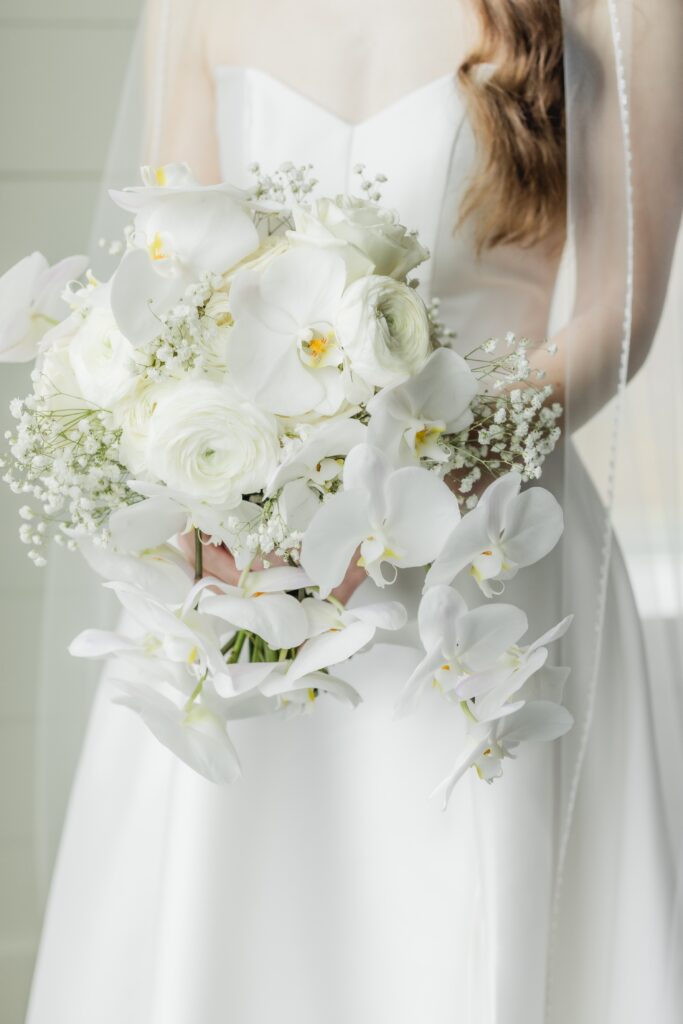 Elegant white bridal bouquet designed for a winter wedding at Ridge Pointe.