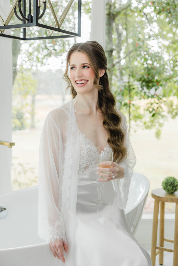 Bride finishing hair and makeup before her Ridge Pointe wedding in Alabama.
