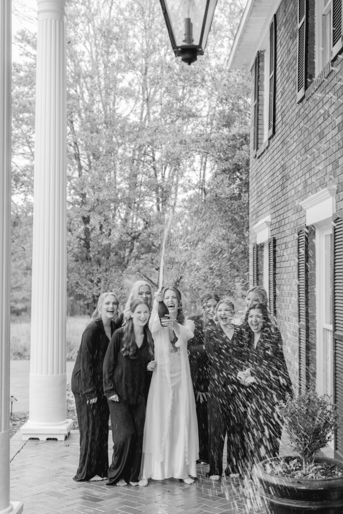 Bride sharing a joyful moment with her bridesmaids before the ceremony at Ridge Pointe.