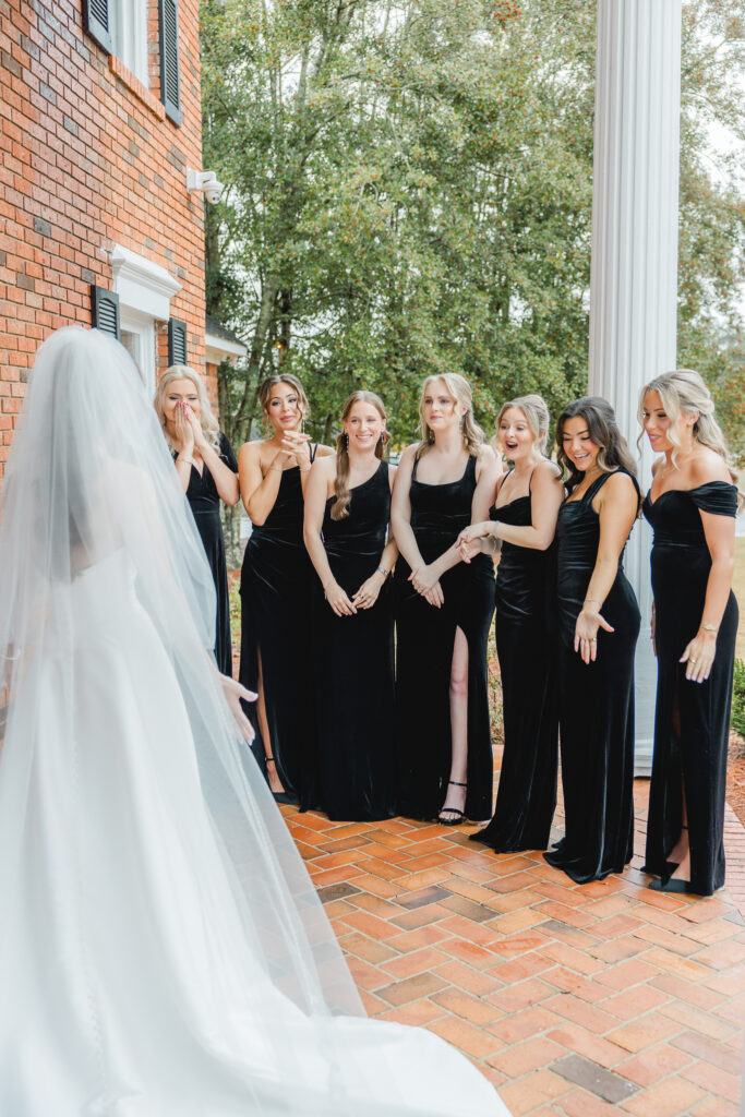 Bridesmaids reactions during a first look photographed by Birmingham wedding photographers.