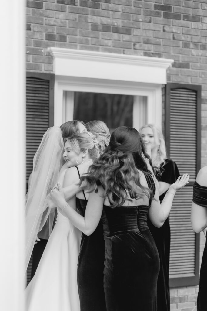 Emotional reactions during a first look with bridesmaids photographed by Birmingham wedding photographers.