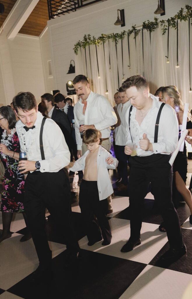 Candid moments captured during a joyful Ridge Pointe wedding reception.