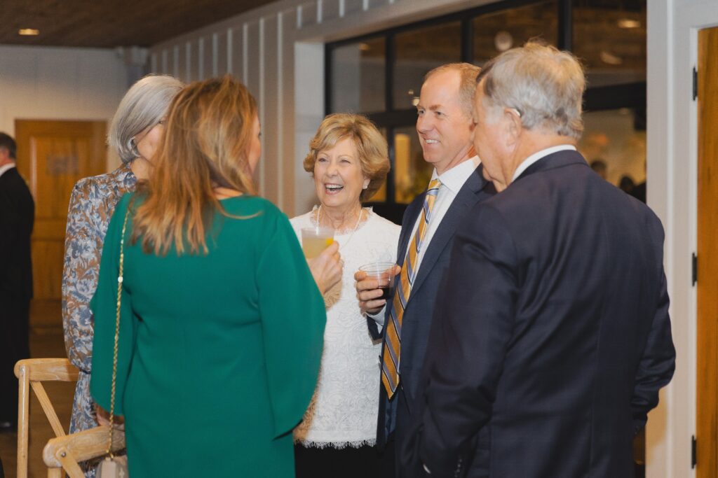 Candid moments captured during a joyful Ridge Pointe cocktail hour.
