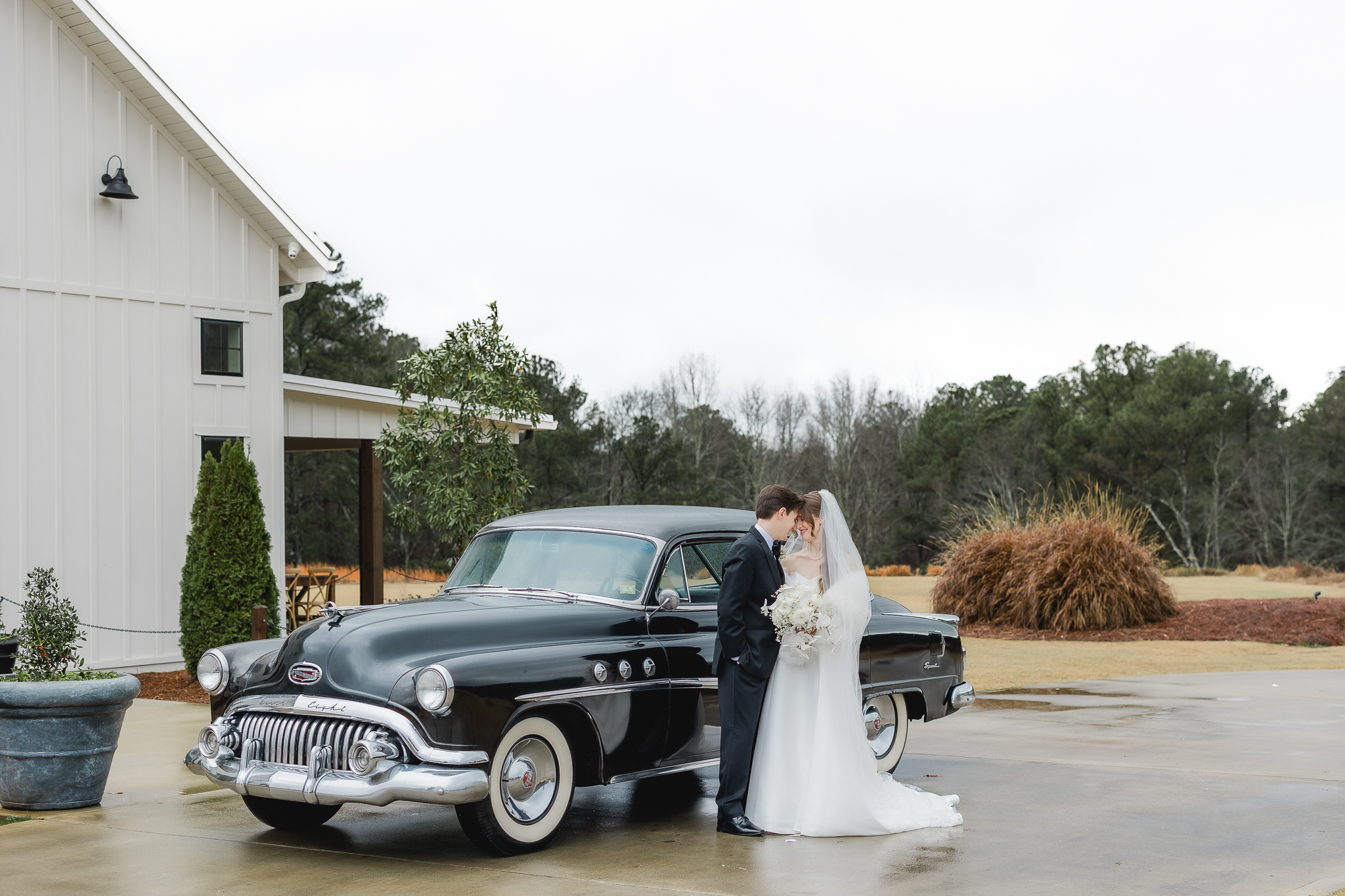 Couple portrait with classic car at Ridge Pointe
