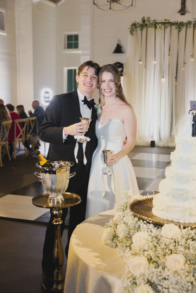 Bride and groom cutting cake at Ridge Pointe reception.
