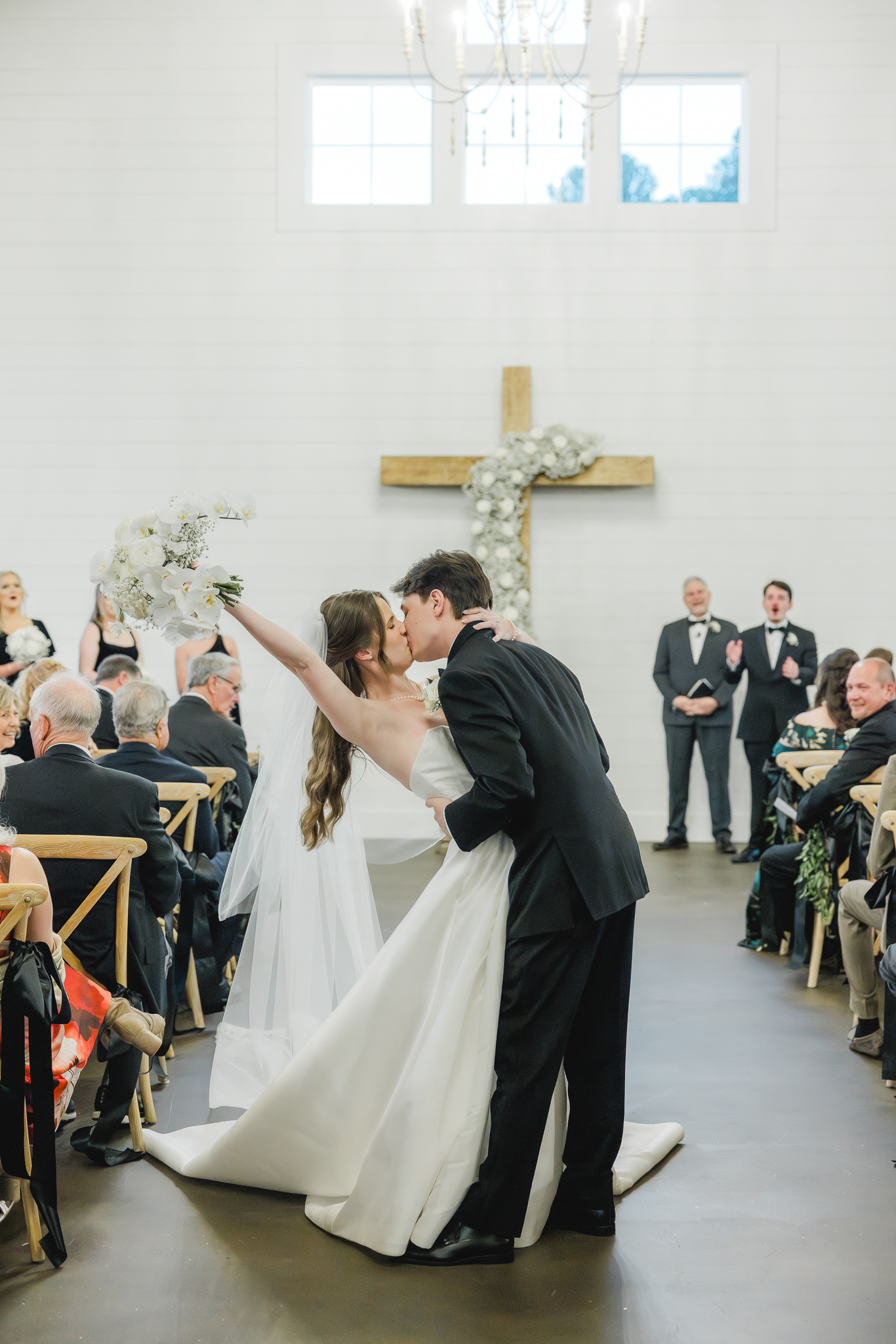 Bride and groom sharing their first kiss as husband and wife at Ridge Pointe.